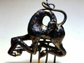 Tenderness, magnesium washed amber glazed earthenware and found altered object. 21x17x6"